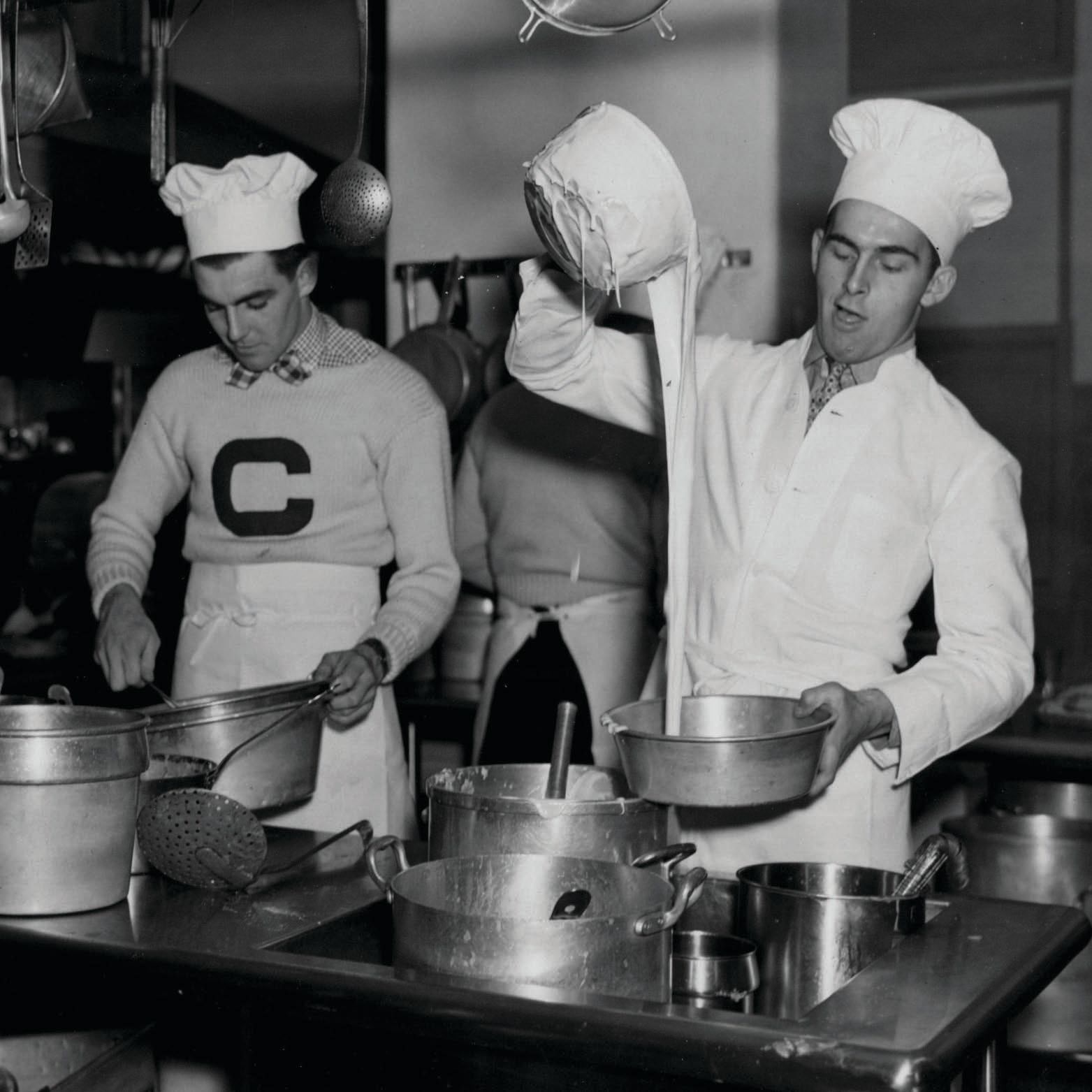 Students in the hotel management course work in the kitchen in the 1920s.