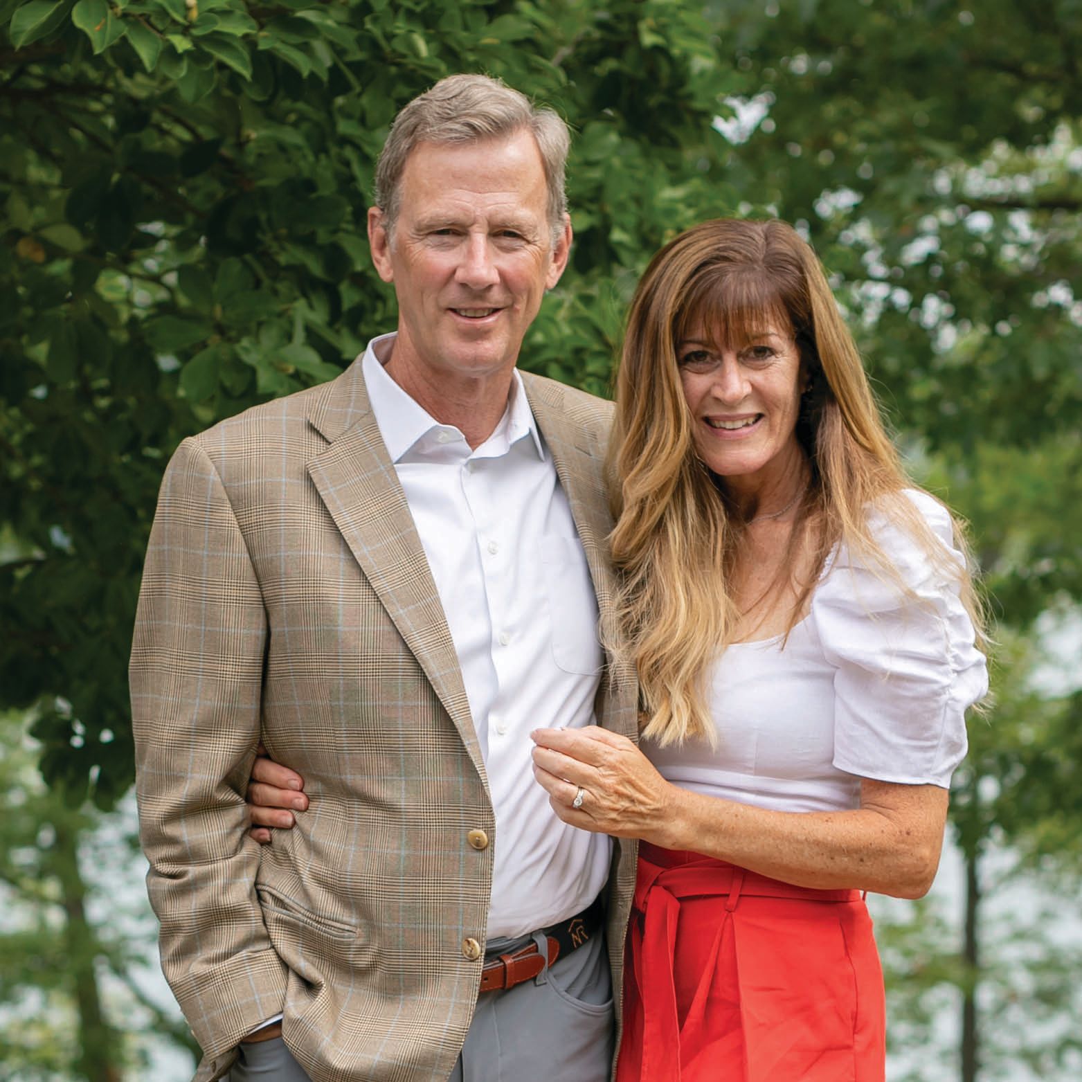 Peter and Stephanie Nolan stand together outside on their property.