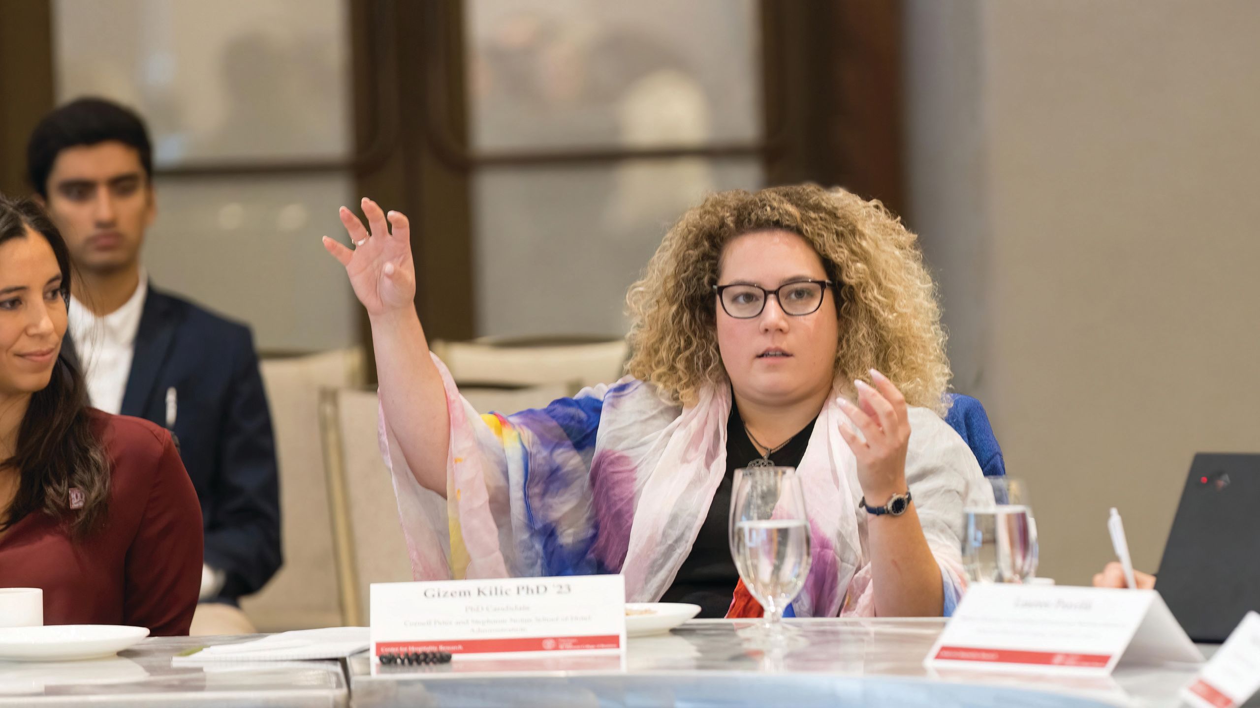 A student speaks with her hands during a CIHLER roundtable in September 2022.